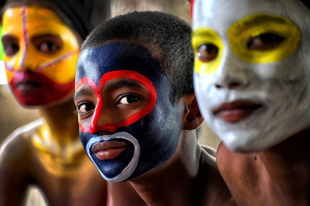 Vibrant Painted Faces by Avishek Das — canvas wall art