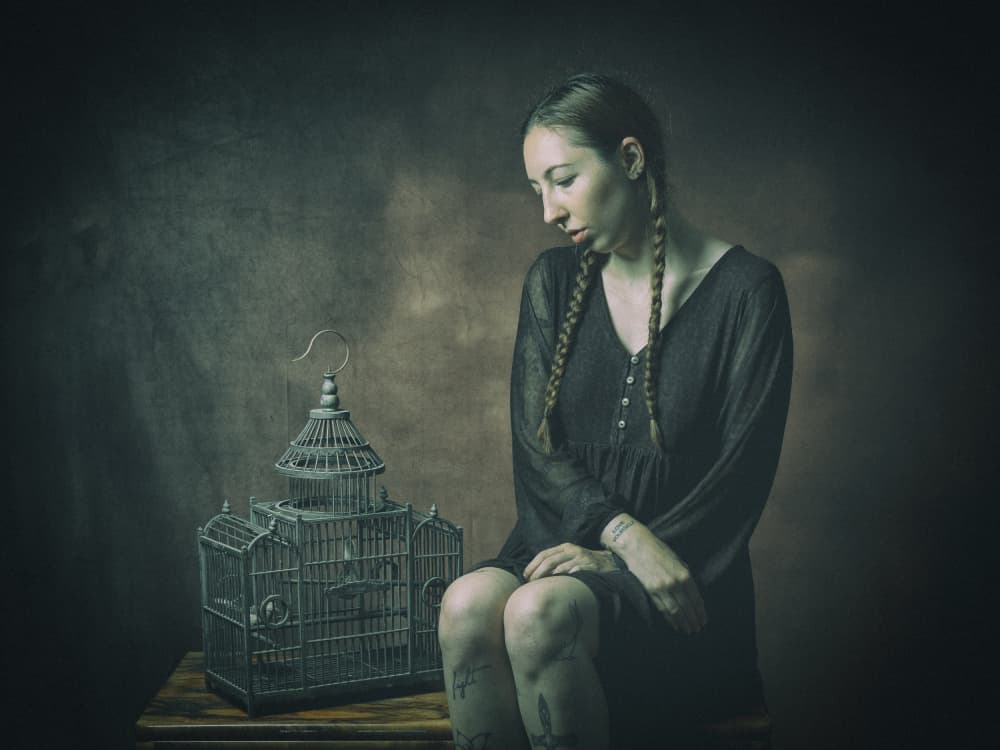 Pensive Woman Empty Cage by Ruth Franke — canvas wall art