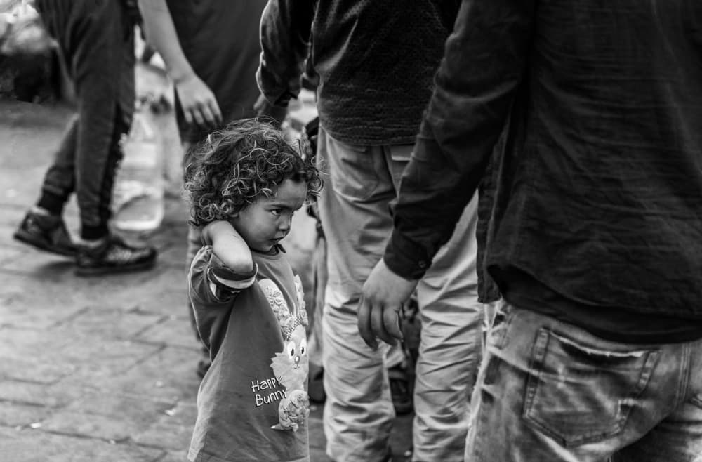 Lonely Child in Crowd by Ömer Ates Kızıltug — canvas wall art