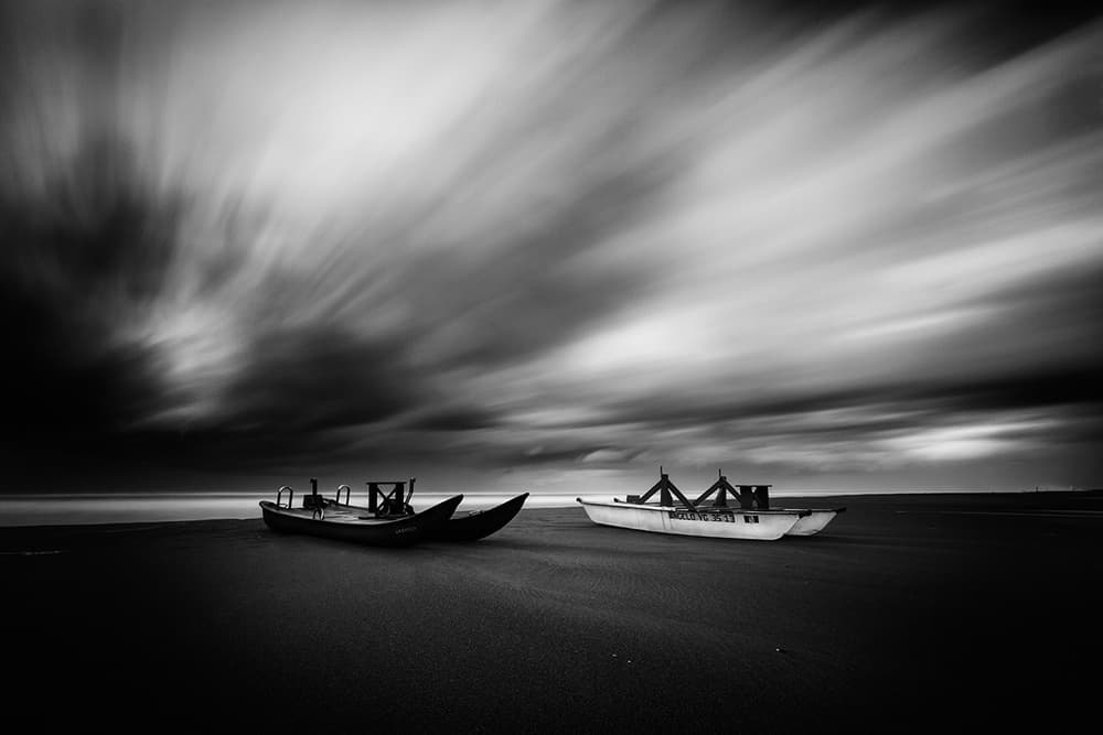 Two Boats Under Vast Sky by Massimo Della Latta — canvas wall art