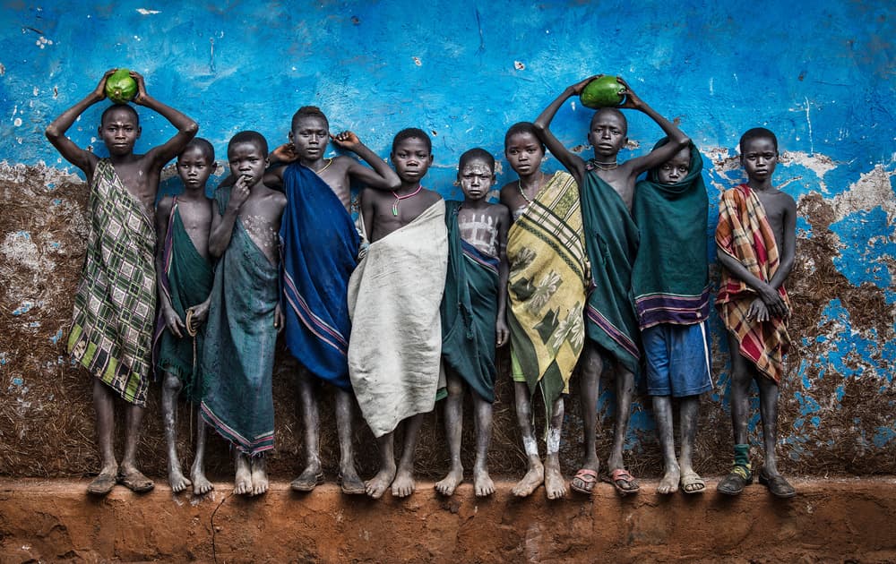 African Boys Blue Wall by Joxe Inazio Kuesta Garmendia — canvas wall art