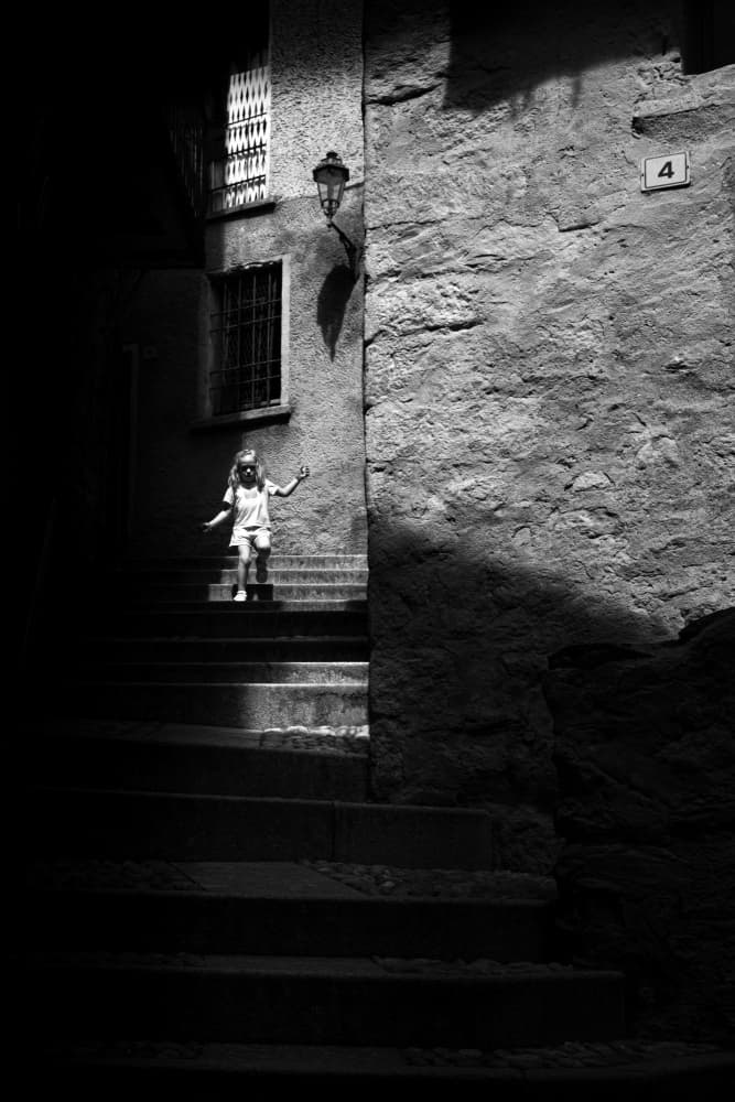 Little Girl in Alley Light by Giorgio Toniolo — canvas wall art