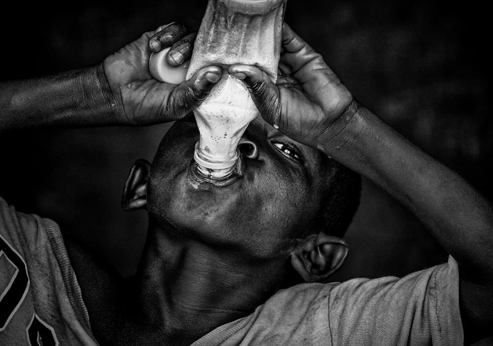 Thirsty Boy Drinking by Joxe Inazio Kuesta Garmendia — canvas wall art