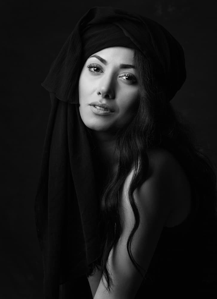 Woman In Black Headwrap by Mehdi Mokhtari — canvas wall art
