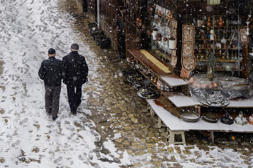 Snowy Cobblestone Market by Fatma GÖKMEN — canvas wall art