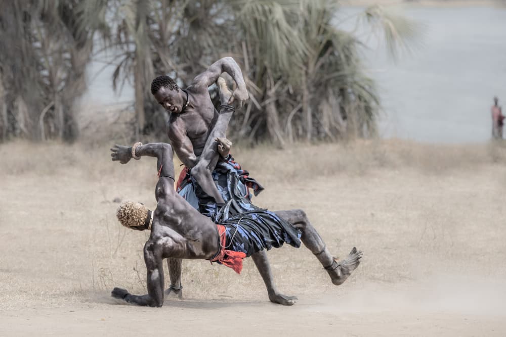 African Wrestling Combat by Trevor Cole — canvas wall art