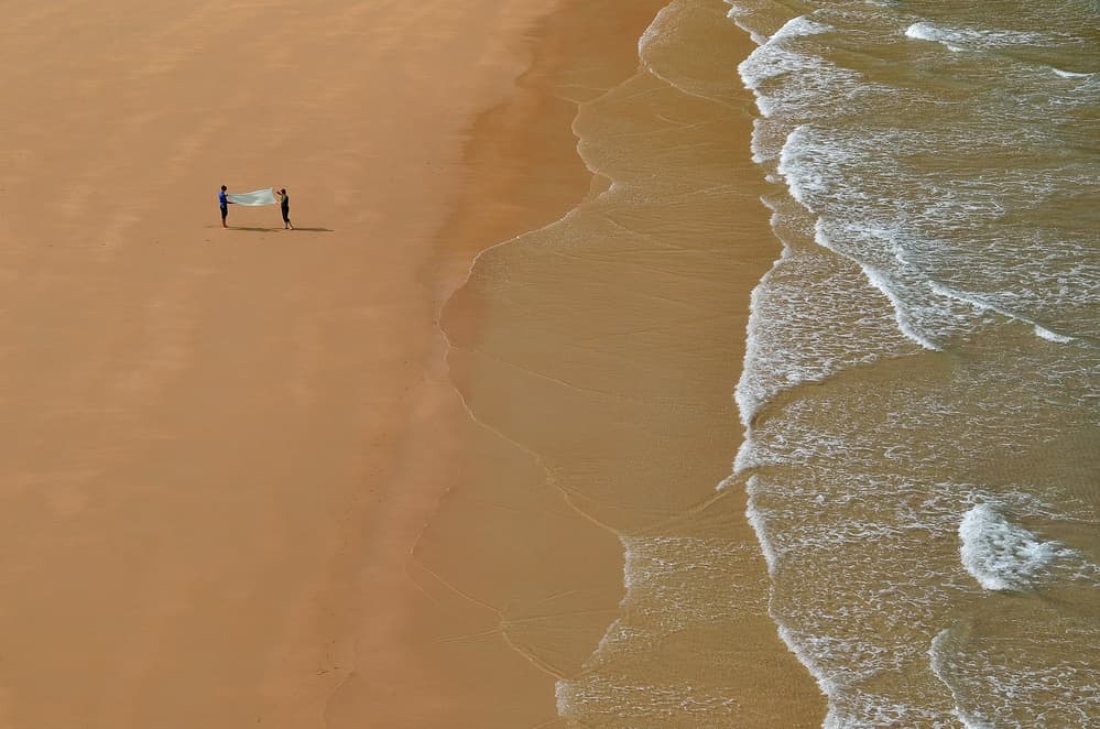 Two Figures Coastal Serenity by Primož Kožuh — canvas wall art