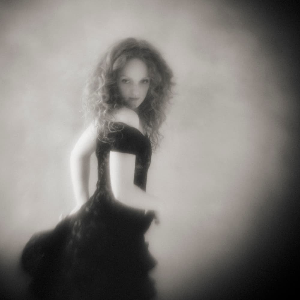 Gazing Woman in Black by Mel Brackstone — canvas wall art