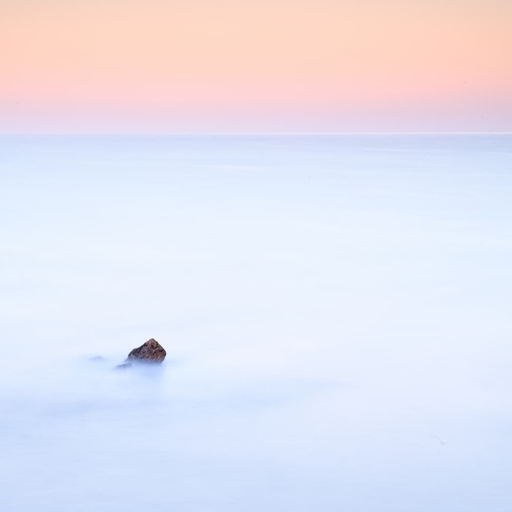 Calm Ocean Lone Rock by Franco Ameli — canvas wall art
