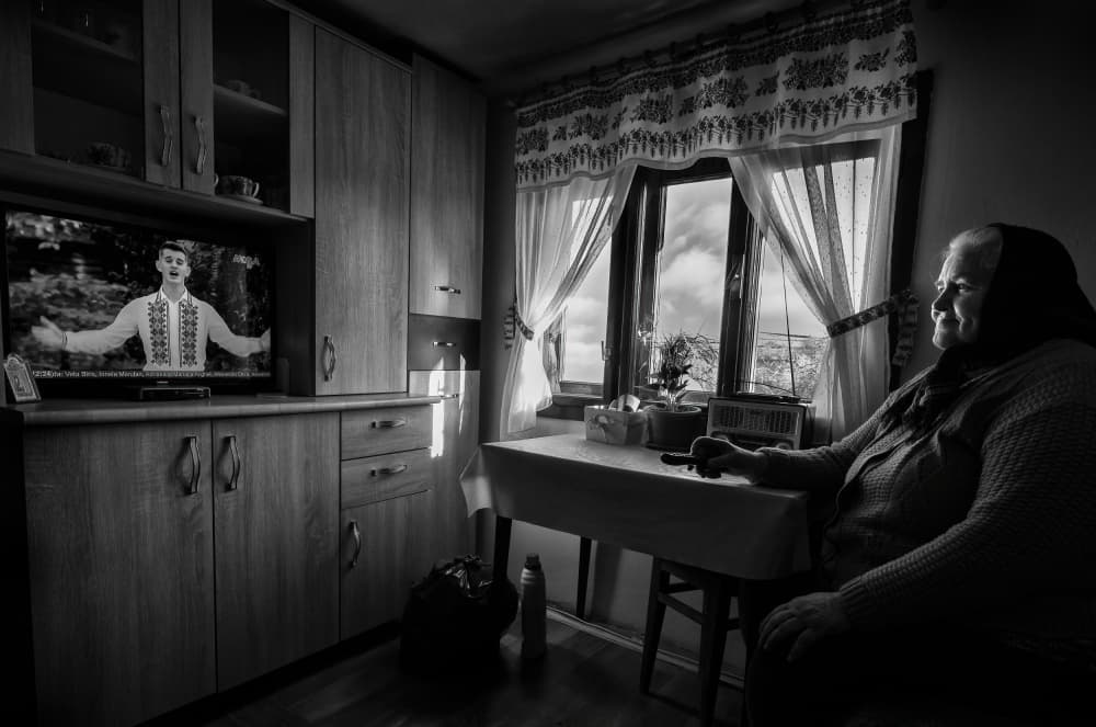 Grandmother Watches Folk Music by Grigore Roibu — canvas wall art