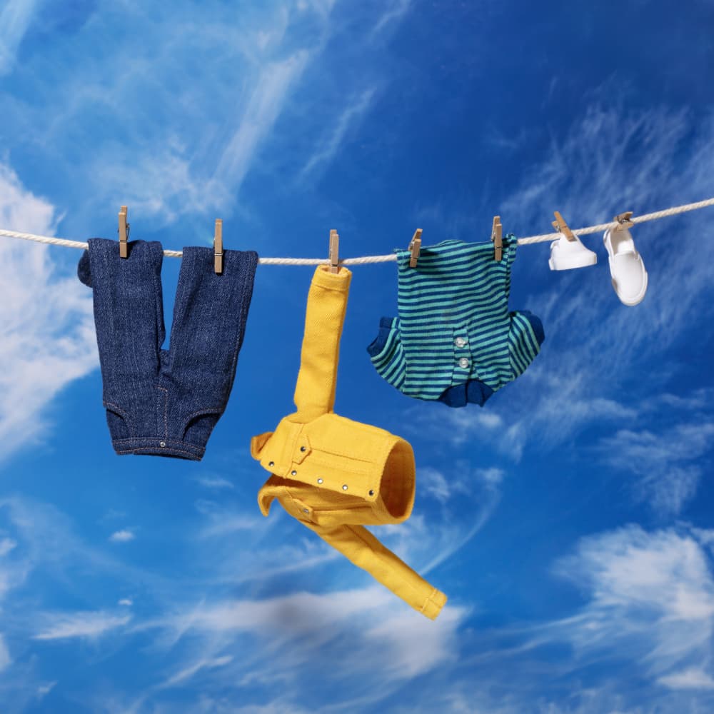 Baby Clothes Drying by Julia Ramiro — canvas wall art