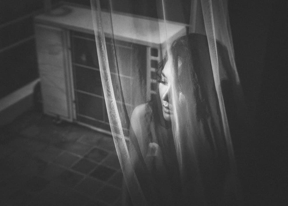 Pensive Woman Behind Sheer by ADIREK M — canvas wall art
