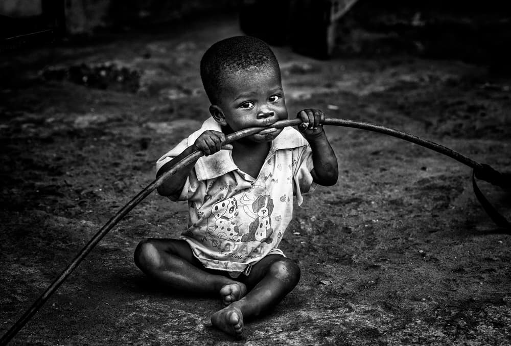 Pensive Child with Stick by Joxe Inazio Kuesta Garmendia — canvas wall art