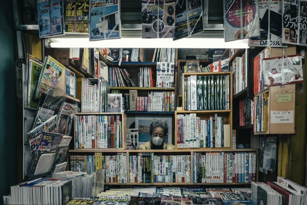 Japanese Bookstore Woman by Tomoshi Hara — canvas wall art