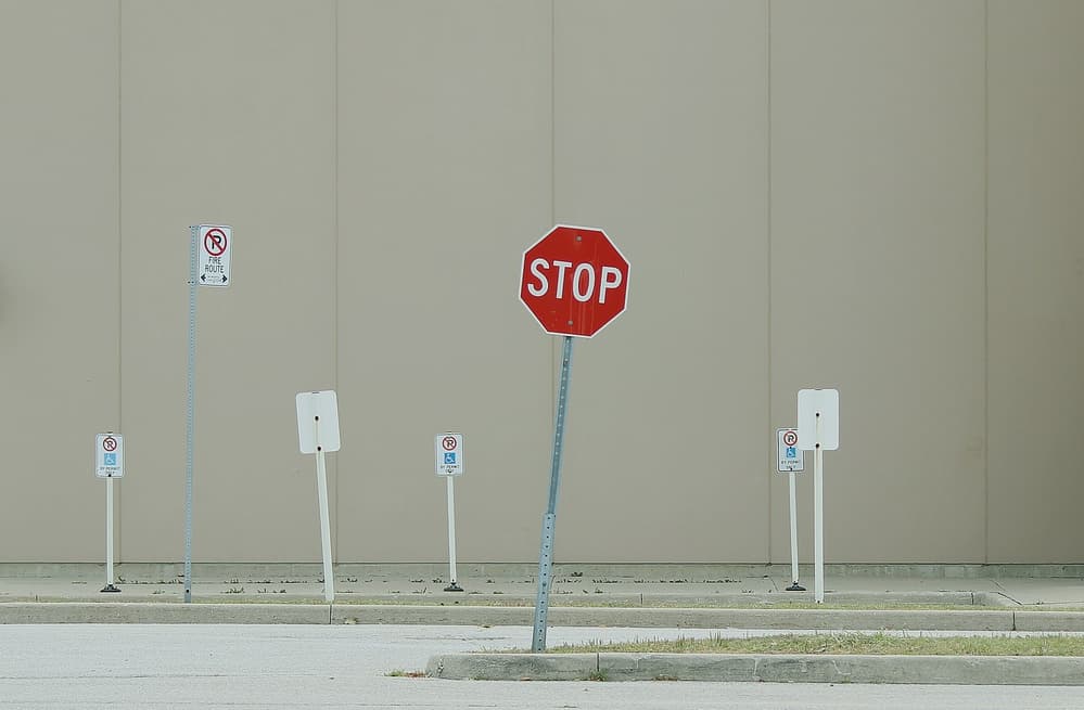 Urban Stop Signs by Jian Wang — canvas wall art