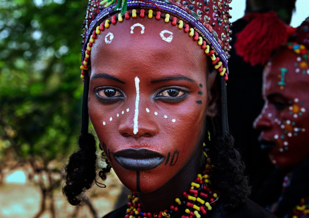 Red Painted African Woman by Joxe Inazio Kuesta Garmendia — canvas wall art
