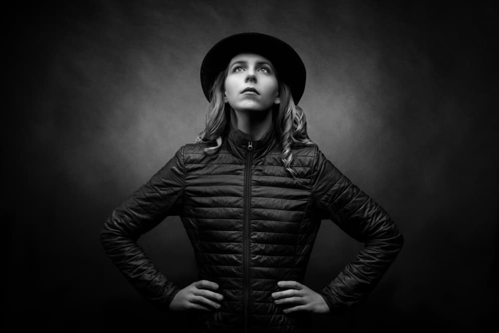 Confident Woman in Hat by Luc Stalmans — canvas wall art