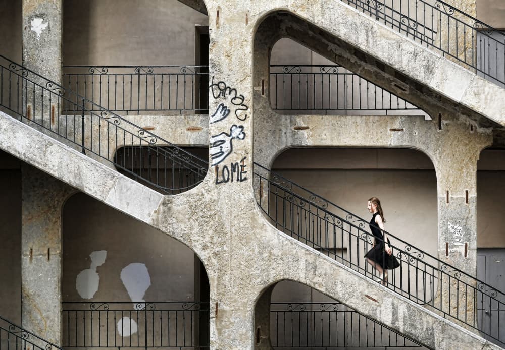 Woman on Brutalist Stairs by Renate Reichert — canvas wall art