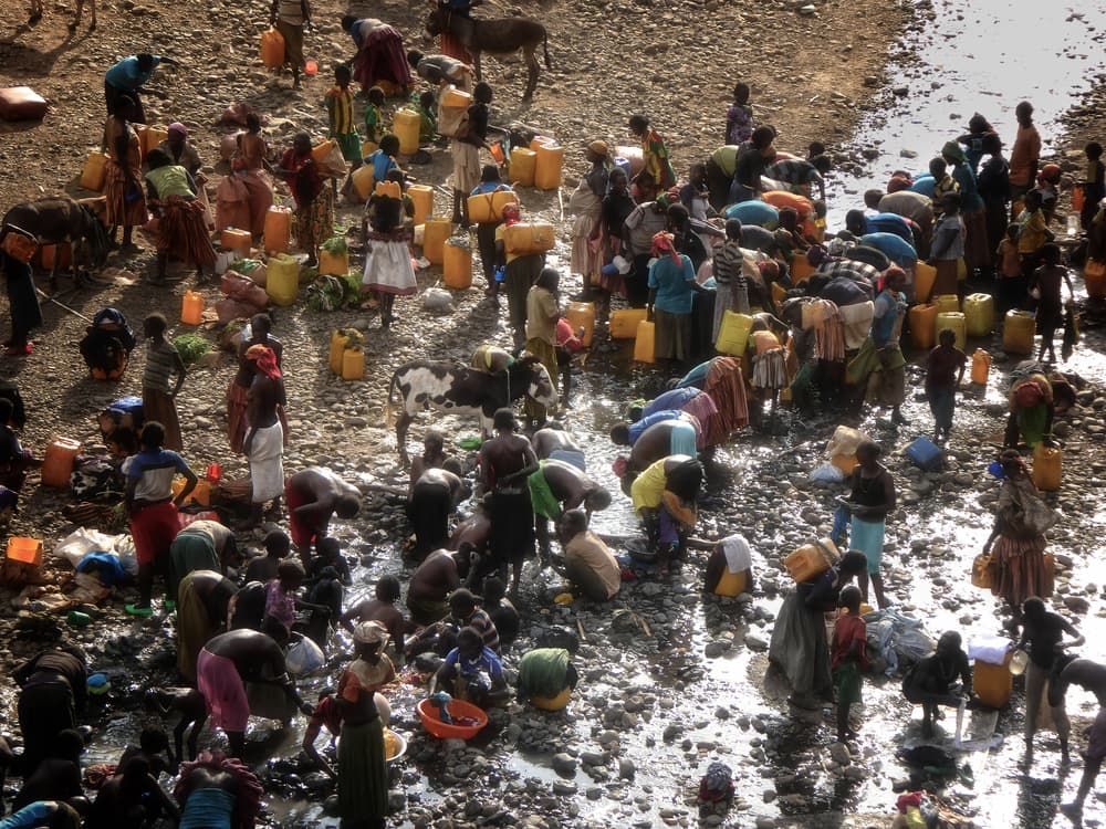 Village Water Gathering by Elena Molina — canvas wall art