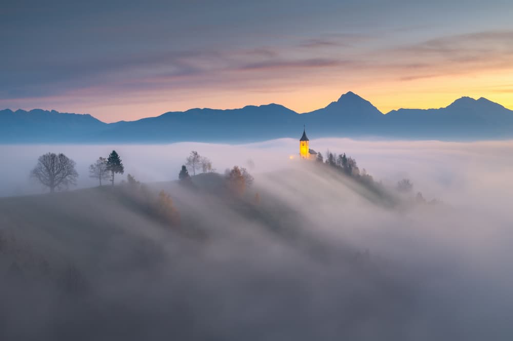 Misty Mountain Church Dawn by Ales Komovec — canvas wall art