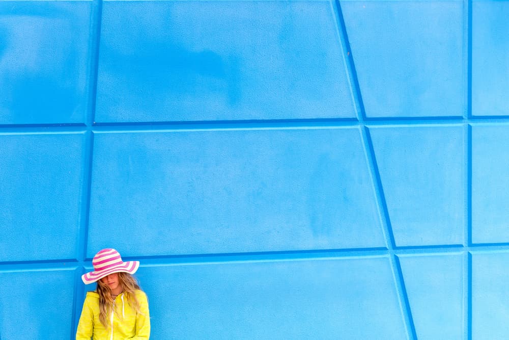 Colorful Girl Blue Wall by Gloria Salgado Gispert — canvas wall art