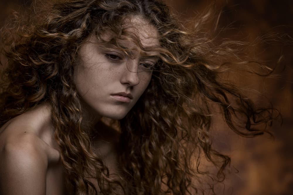 Pensive Curly Haired Woman by Carine Belzon — canvas wall art