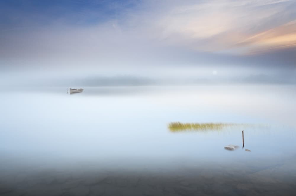 Lone Boat Misty Lake by Martin Marcisovsky — canvas wall art