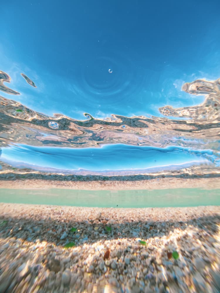 Underwater Beach Sky Split by Hilal safarjalani — canvas wall art