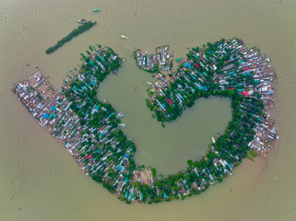Heart-Shaped River Village by Azim Khan Ronnie — canvas wall art