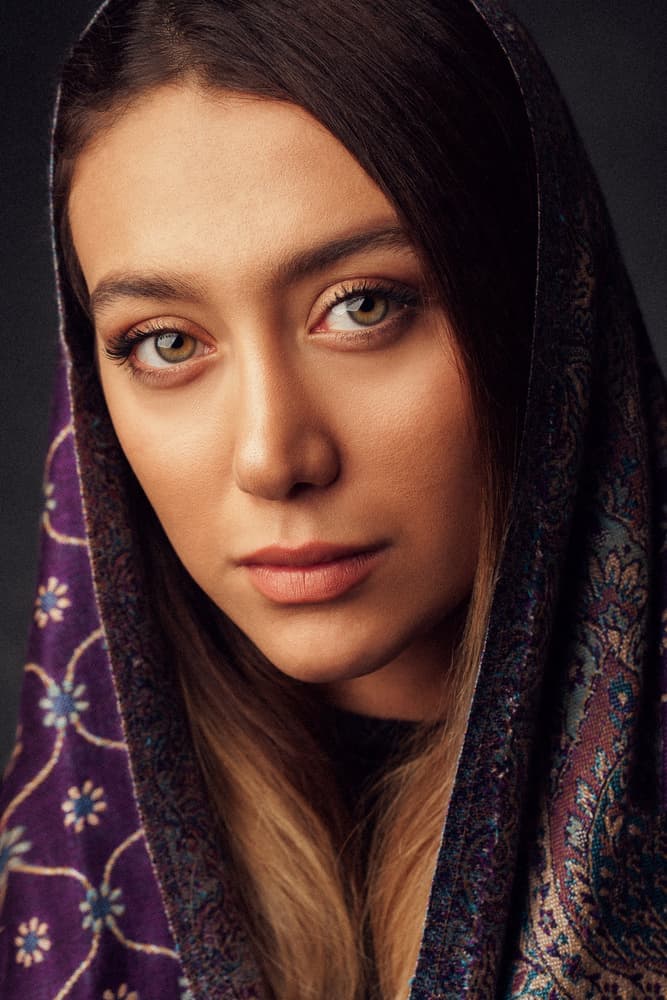 Serene Woman in Purple Scarf by Mehdi Mokhtari — canvas wall art