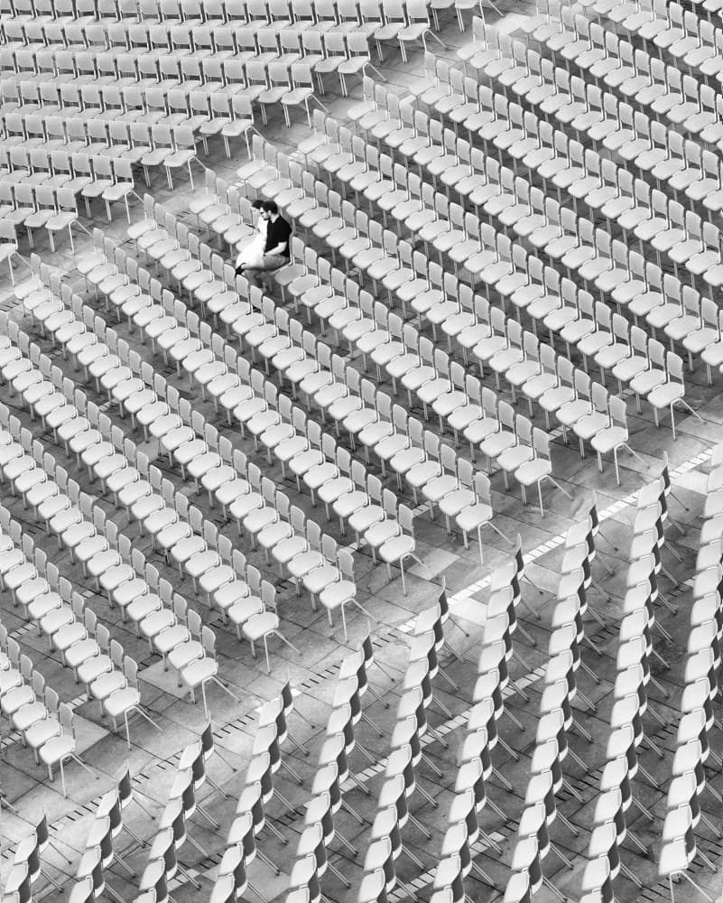 Lone Figure Empty Chairs by Sebastian Prioteasa — canvas wall art