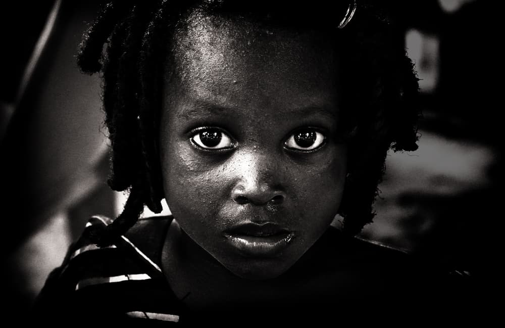 Child's Intense Gaze by Elena Molina — canvas wall art