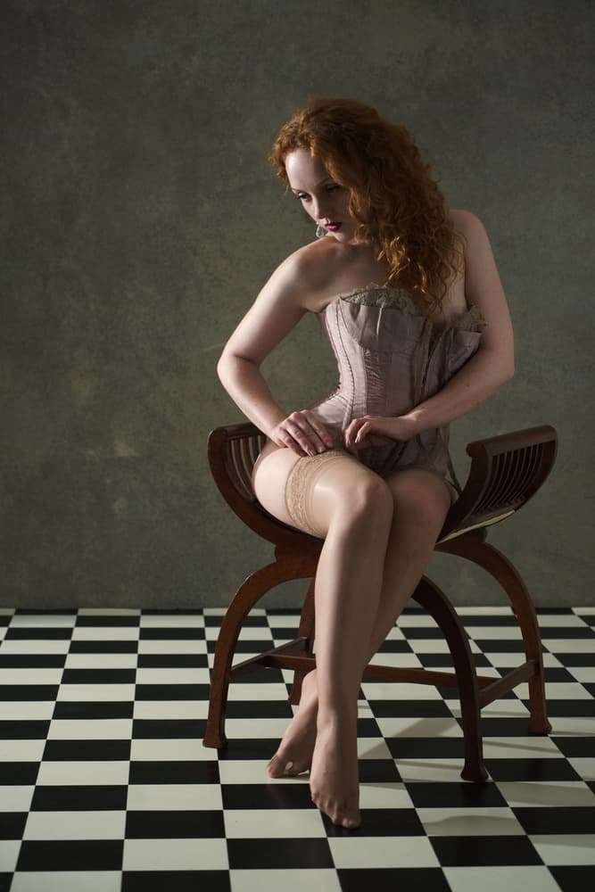 Pensive Redhead in Corset by Mel Brackstone — canvas wall art