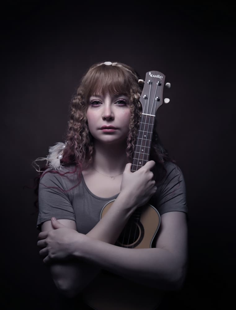 Pensive Ukulele Player by Moein Hasheminasab — canvas wall art