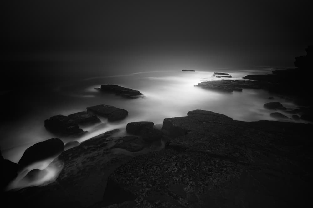 Dark Ocean Rocks by Paulo Abrantes — canvas wall art