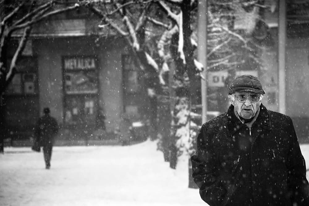 Elderly Man Winter Walk by Nicoleta Gabor — canvas wall art