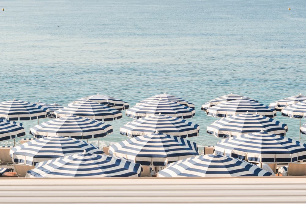 Blue Striped Beach Umbrellas by Talitha McQueen — canvas wall art
