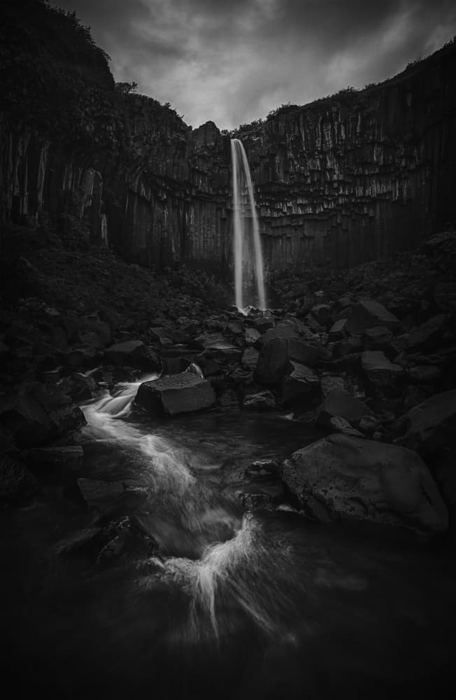 Moody Cliff Waterfall by Lydia Jacobs — canvas wall art
