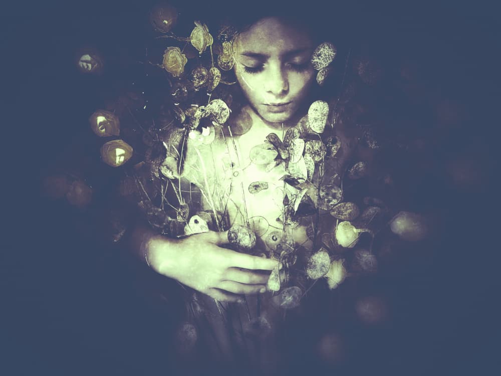 Girl Holding Golden Leaves by Delphine Margau — canvas wall art