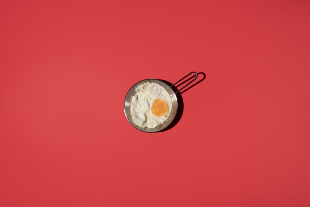 Fried Egg On Red by Julia Ramiro — canvas wall art