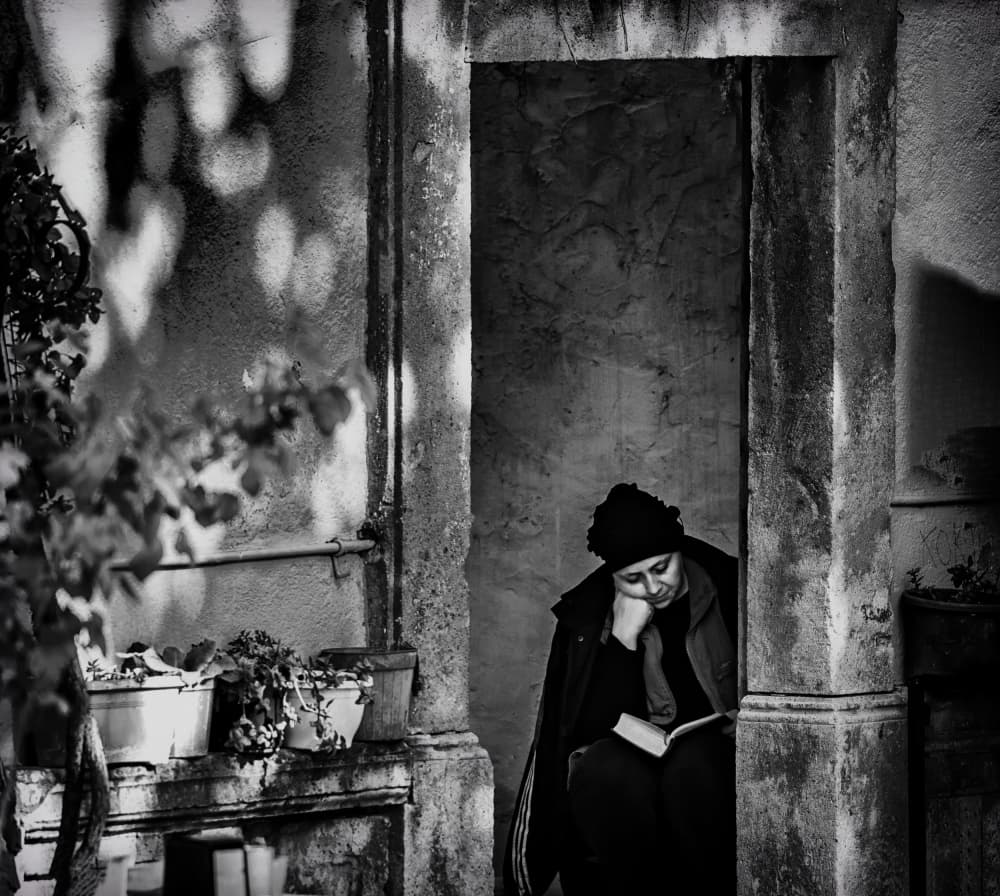 Woman Reading In Shadows by Ömer Ates Kızıltug — canvas wall art