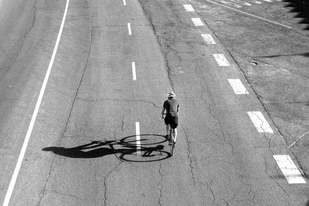 Road Cycling Shadow by Tamas Dragon — canvas wall art