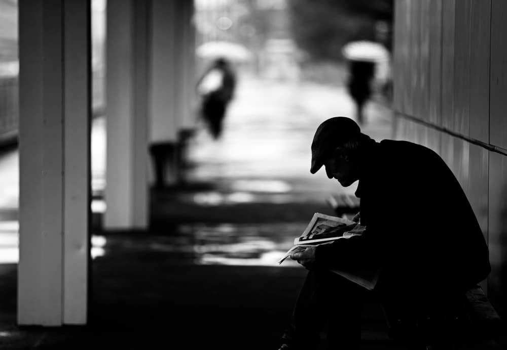 Solitary Street Reader by Julien Oncete — canvas wall art