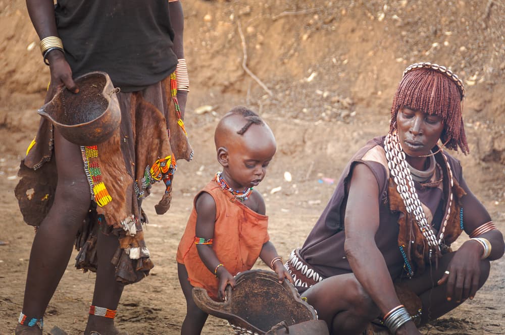 Omo Valley Family Scene by carmenvillar — canvas wall art