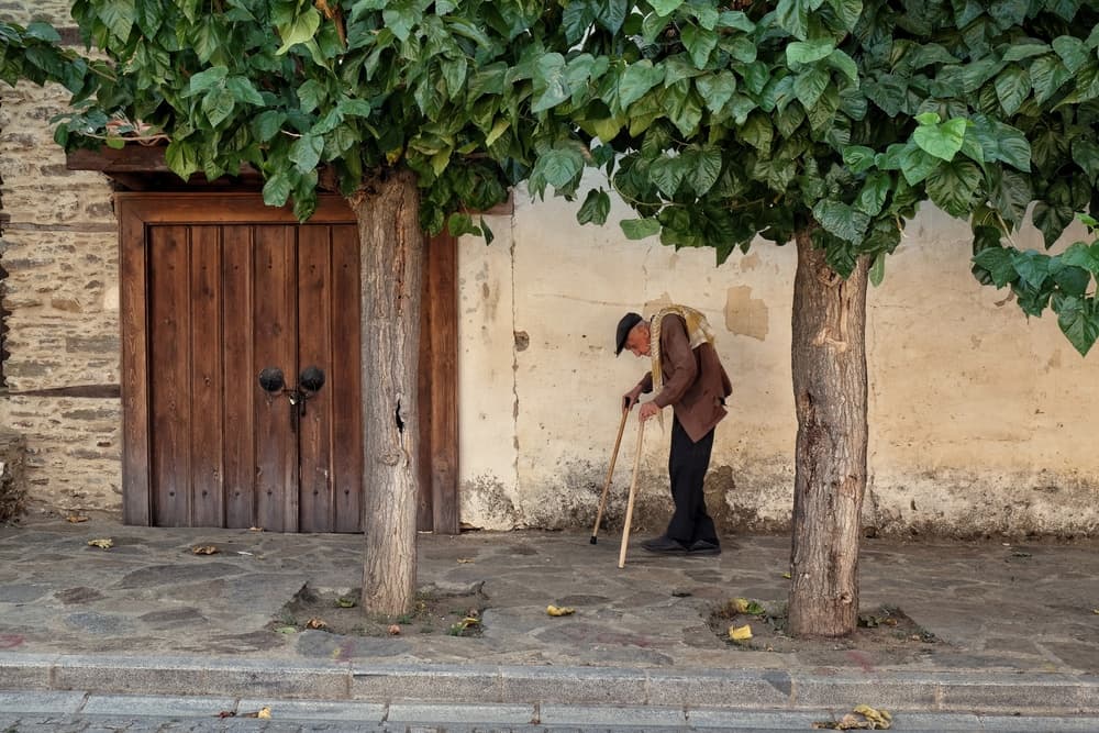Old Man Village Street by Ali Ayer — canvas wall art
