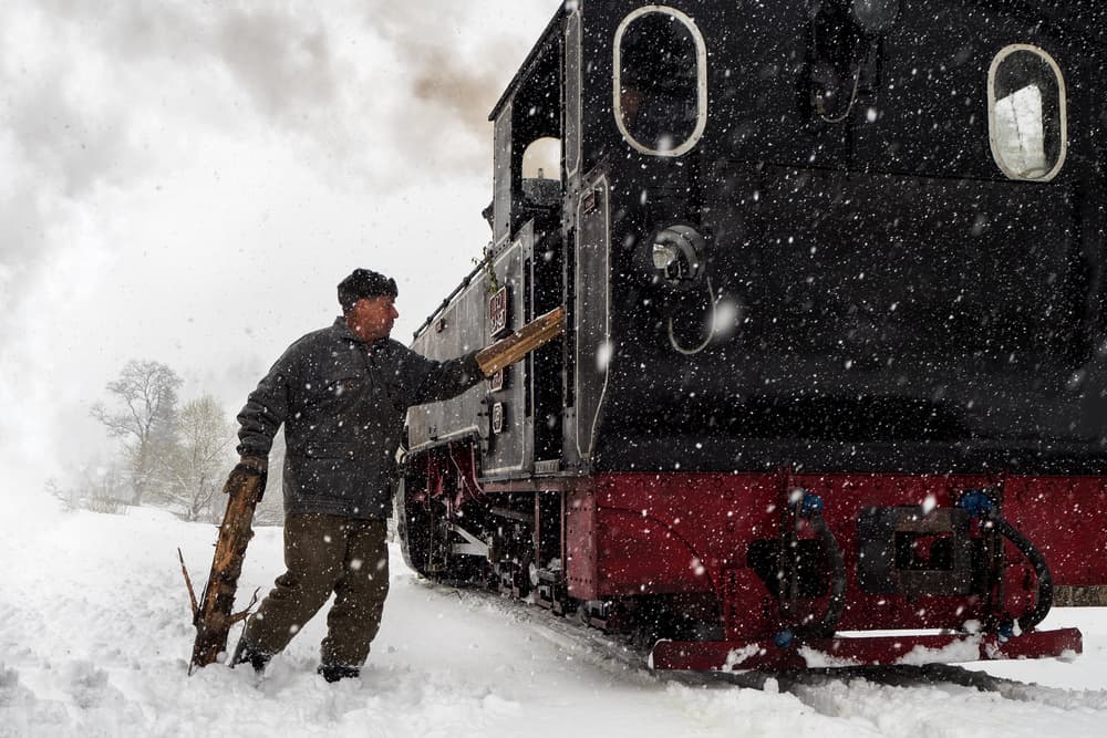 Snowy Steam Train Journey by Marius Cinteza — canvas wall art
