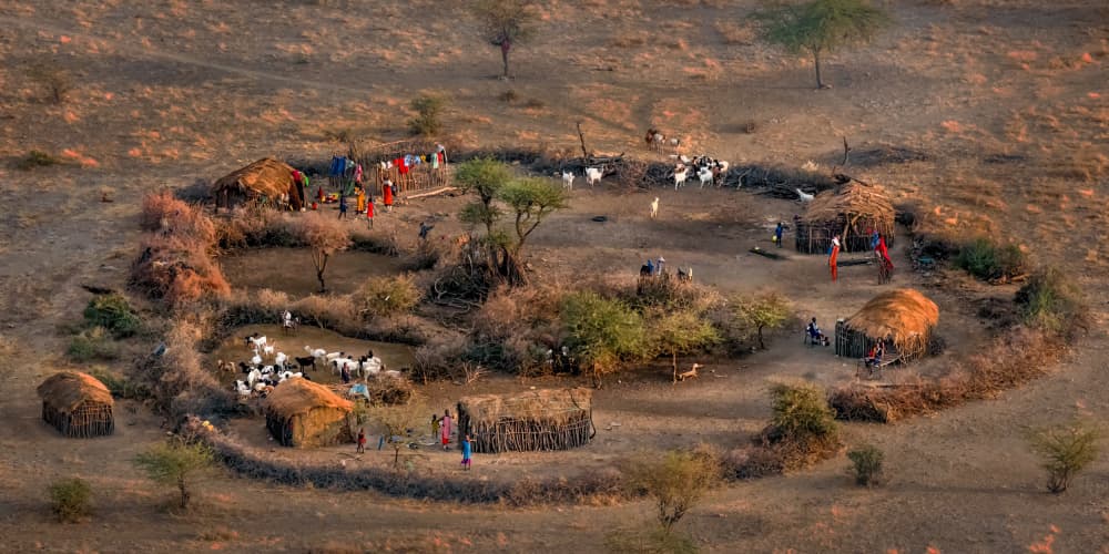 Maasai Village Life by John J. Chen — canvas wall art