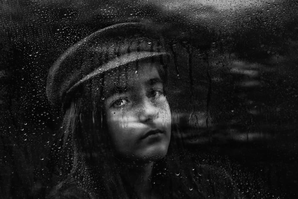 Pensive Girl By Rainy Window by Ummu Nisan Kandilcioglu — canvas wall art