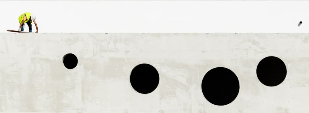Worker on Concrete Wall by João Castro — canvas wall art