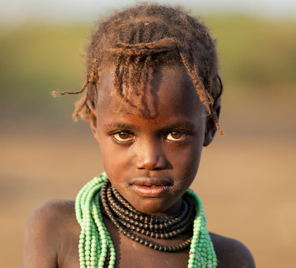 African Child's Gaze by Hamza Qarooni — canvas wall art